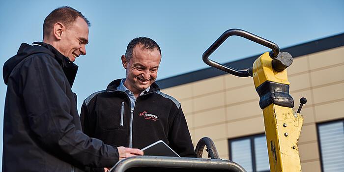 Two men in conversation